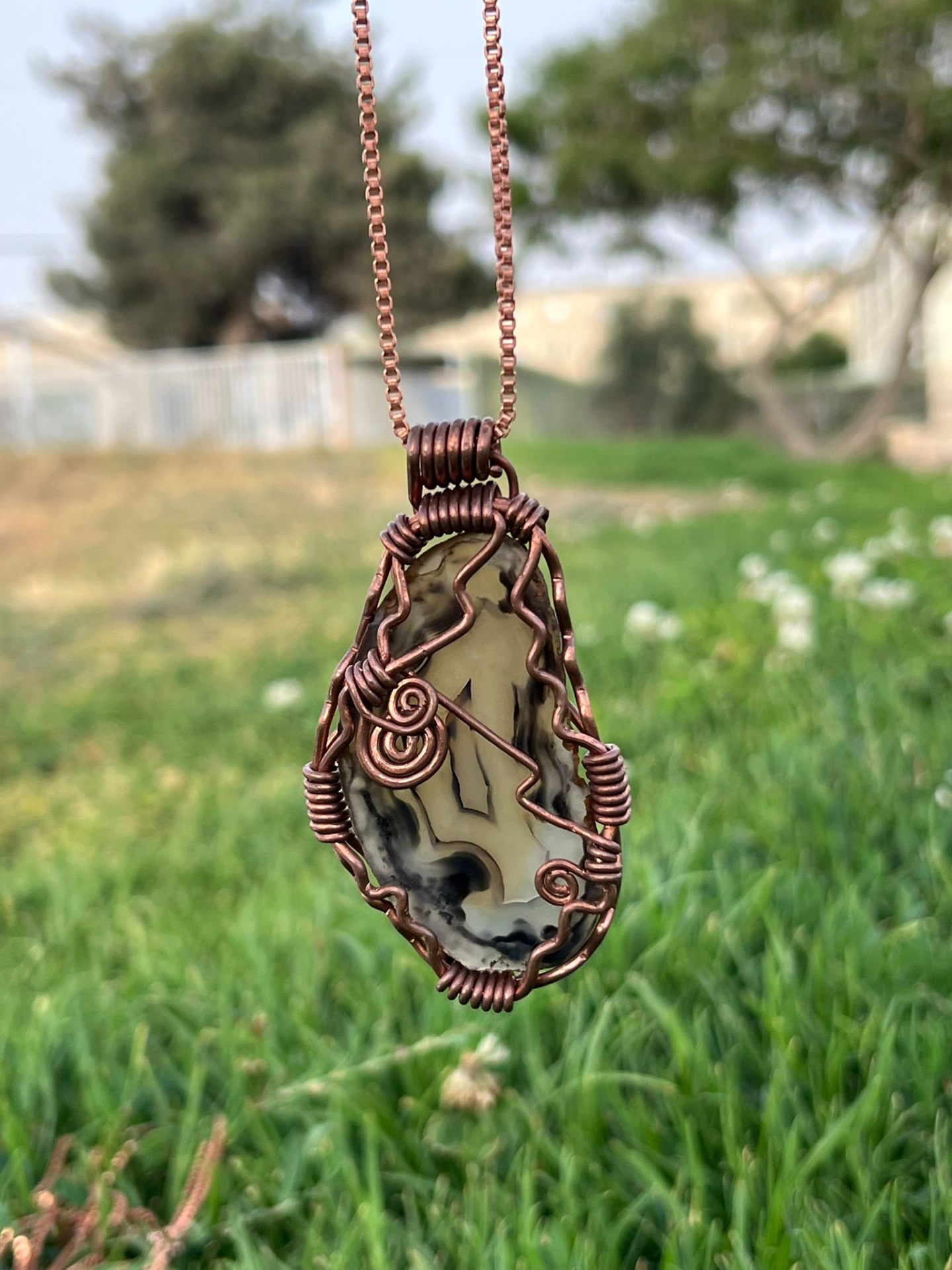 Maze agate pendant hand-wrapped in warm brass